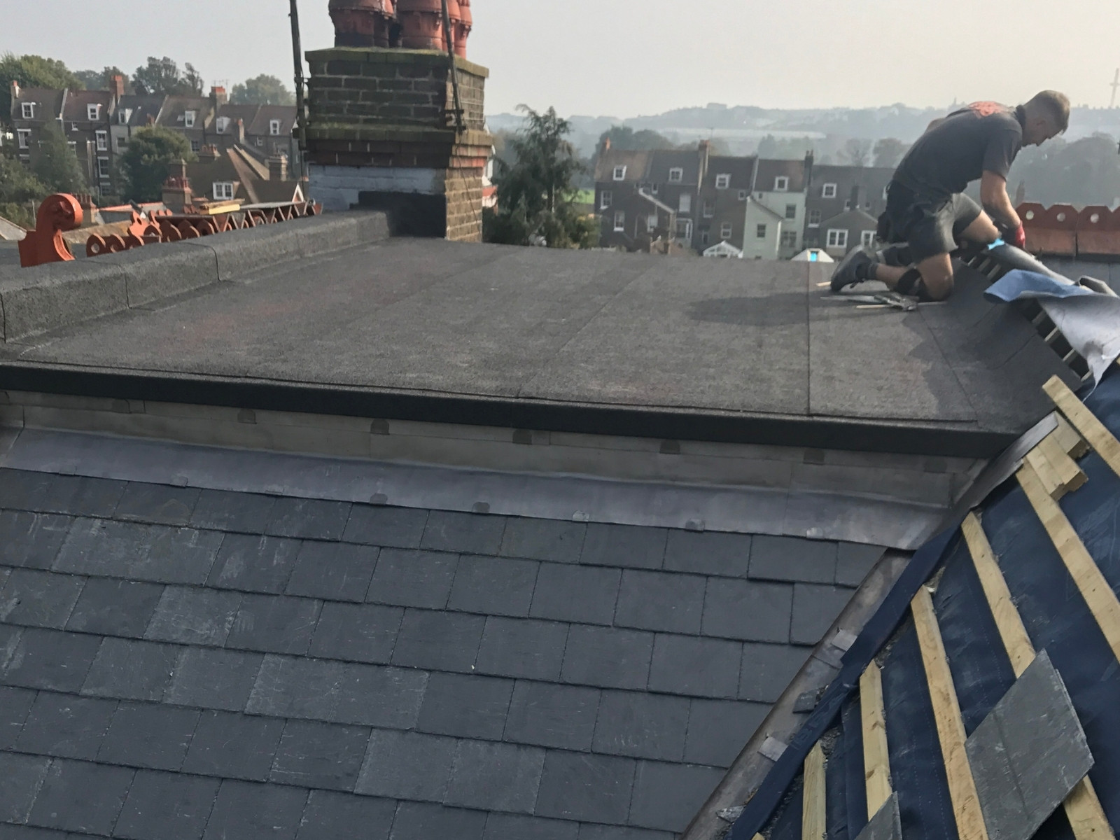 Lead flashing and chimney repair work on pitched roof
